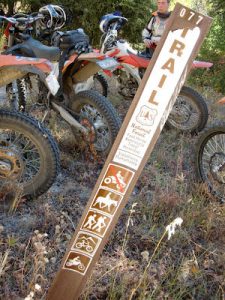 motorcycles and trail sign
