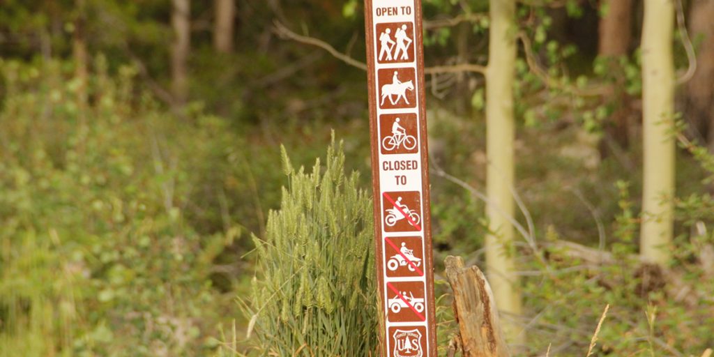 Trail sign - closed to motorcycles